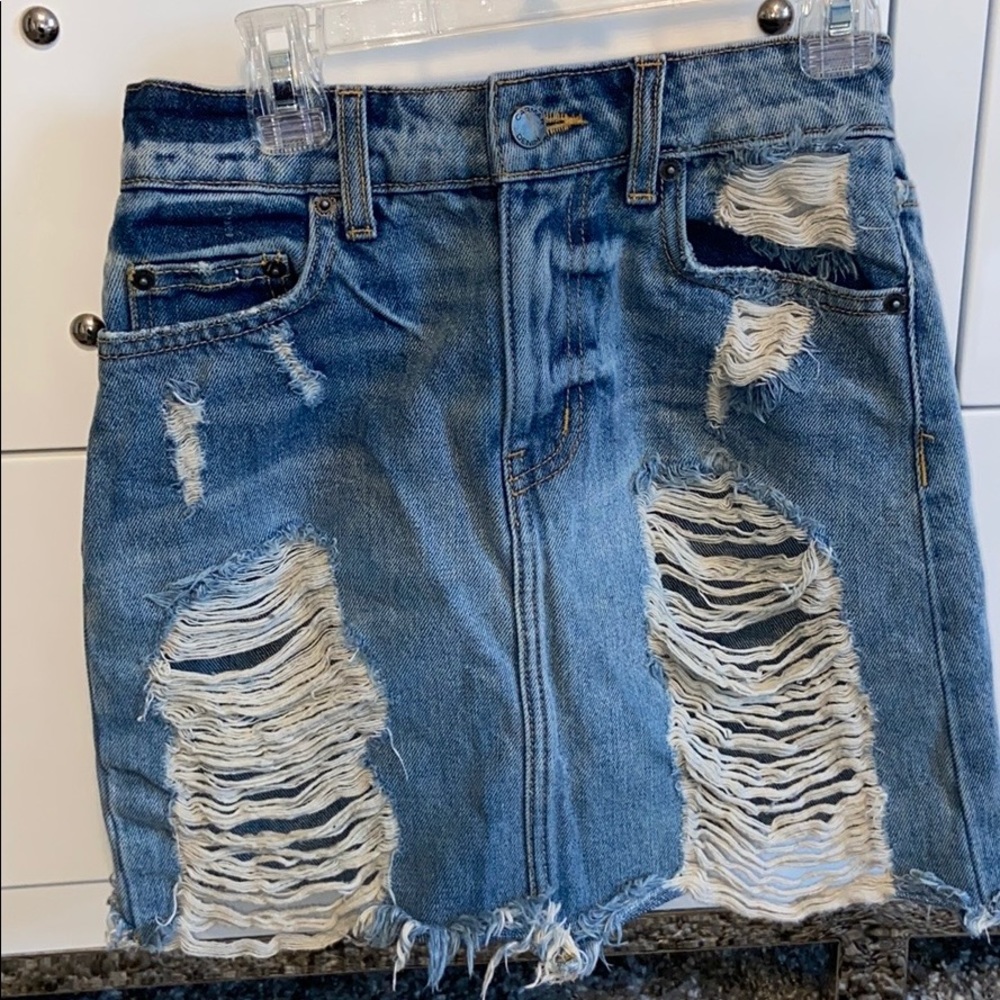 denim skirt with rips and fringes